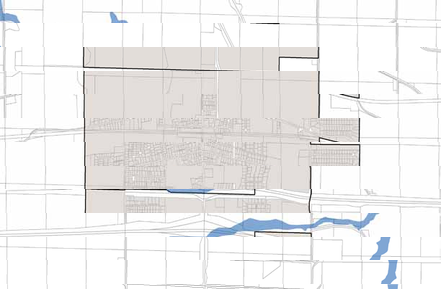 A simple map highlighting a central shaded urban area and blue water bodies.