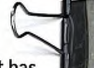 Image of a paper clip attached to a document.