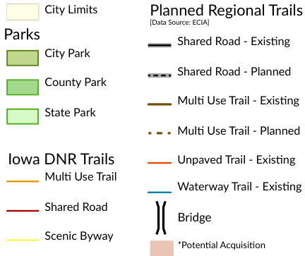 The legend outlines city limits, parks, and planned regional trails, differentiating between various trail types such as multi-use, shared roads, and unpaved trails. It includes symbols for existing roads, proposed paths, and features like bridges, with a note about potential acquisition.
