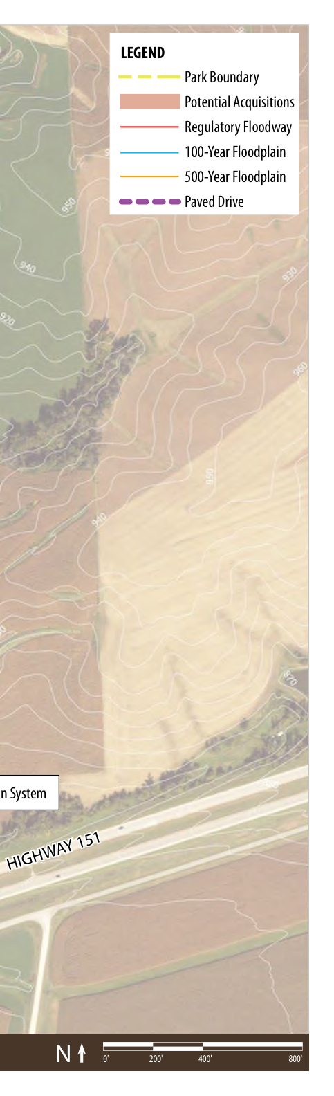 The map illustrates the geographical layout of an area with contours and floodplain designations. It includes a legend that explains the markings for park boundaries, potential acquisitions, regulatory floodway, 100-year floodplain, 500-year floodplain, and paved drive. Major features like 'HIGHWAY 151' are marked, along with directional indicators and scale bars to assist in navigation.